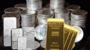 Lingotes de y monedas de oro y plata