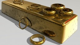 Anillos de oro sobre lingote de oro